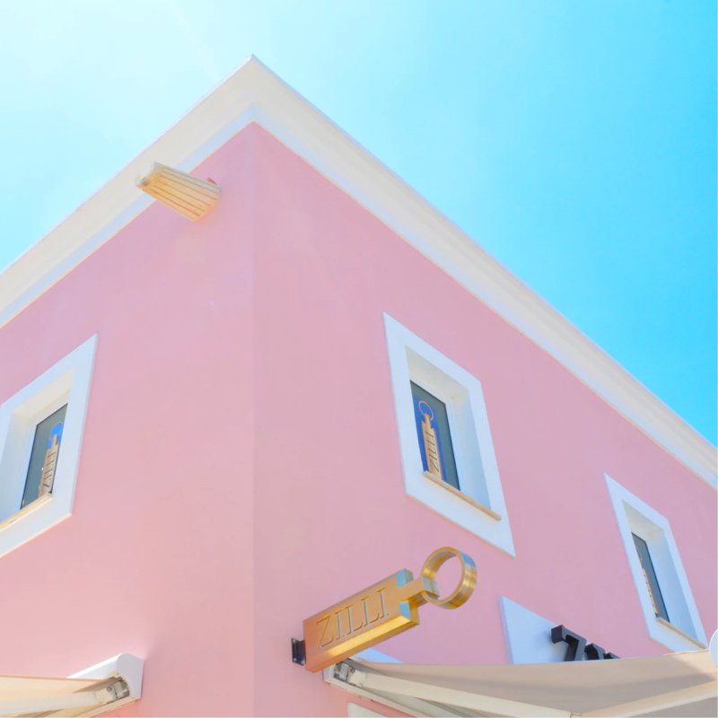 Top corner of pink building with gold accents